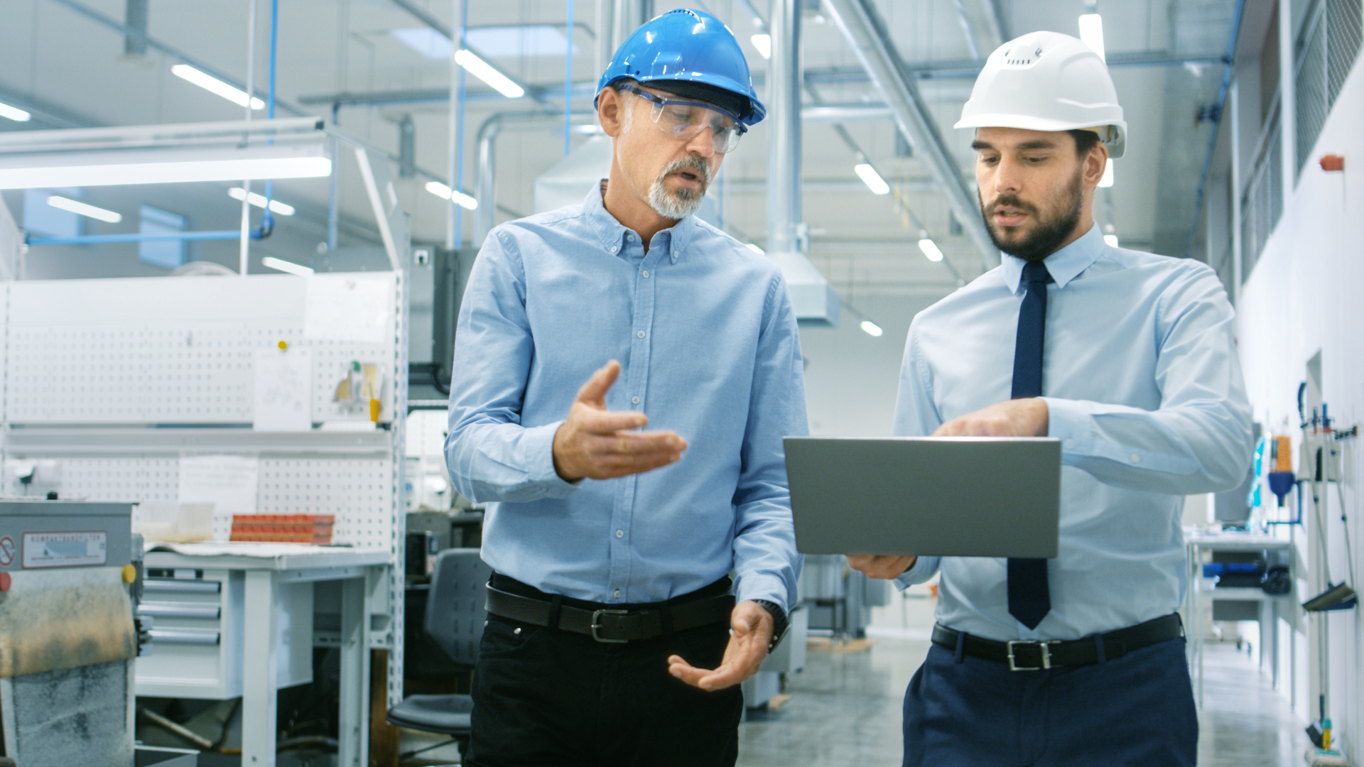 two workers discussing plans